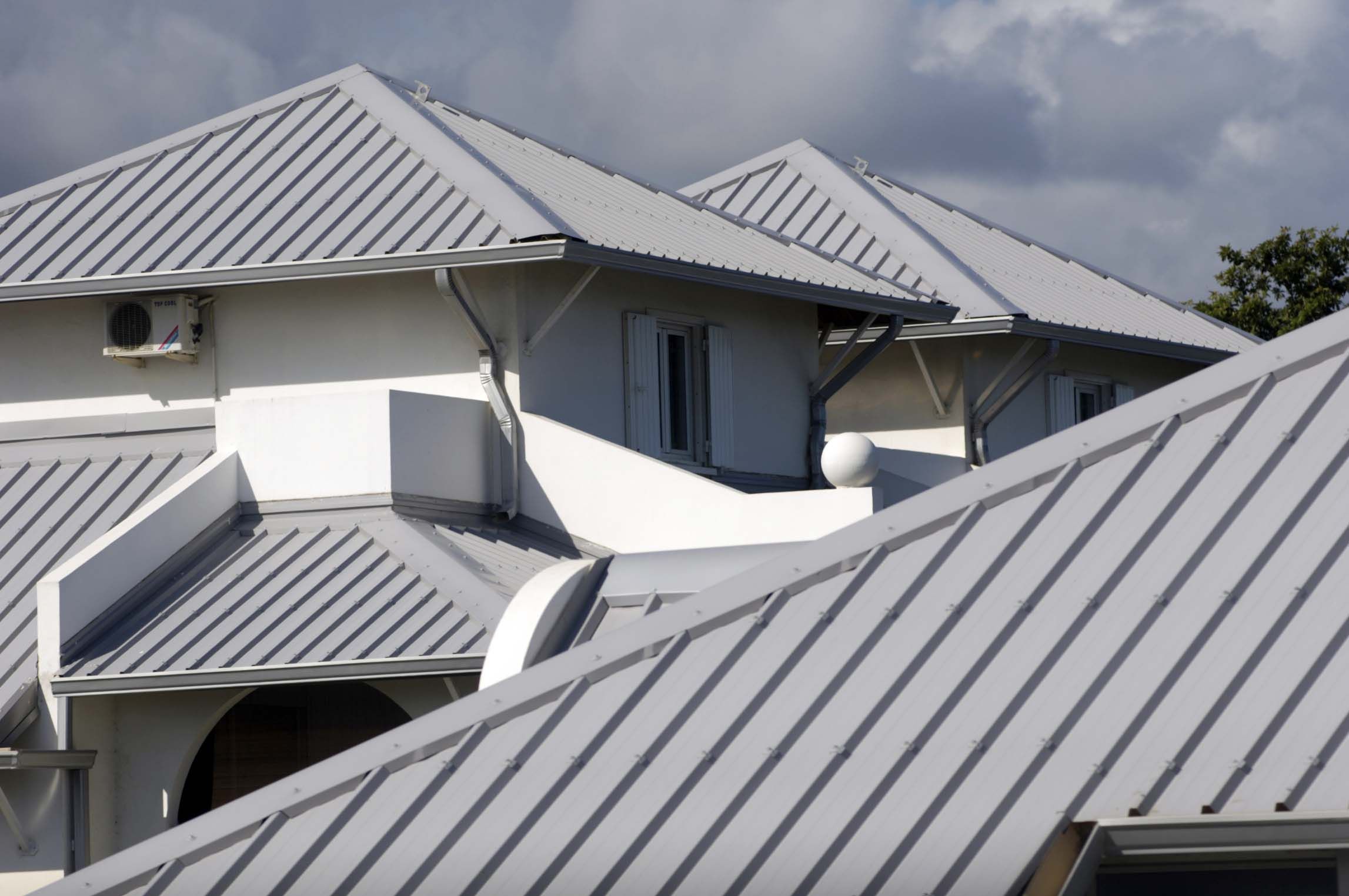 Complex residential home with metal roof